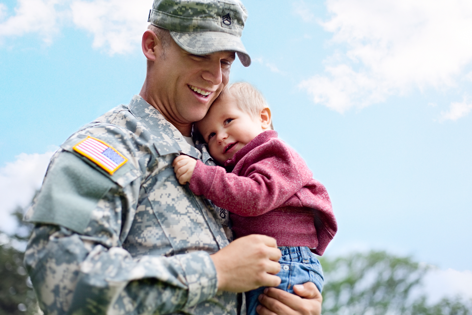 veteran holding baby